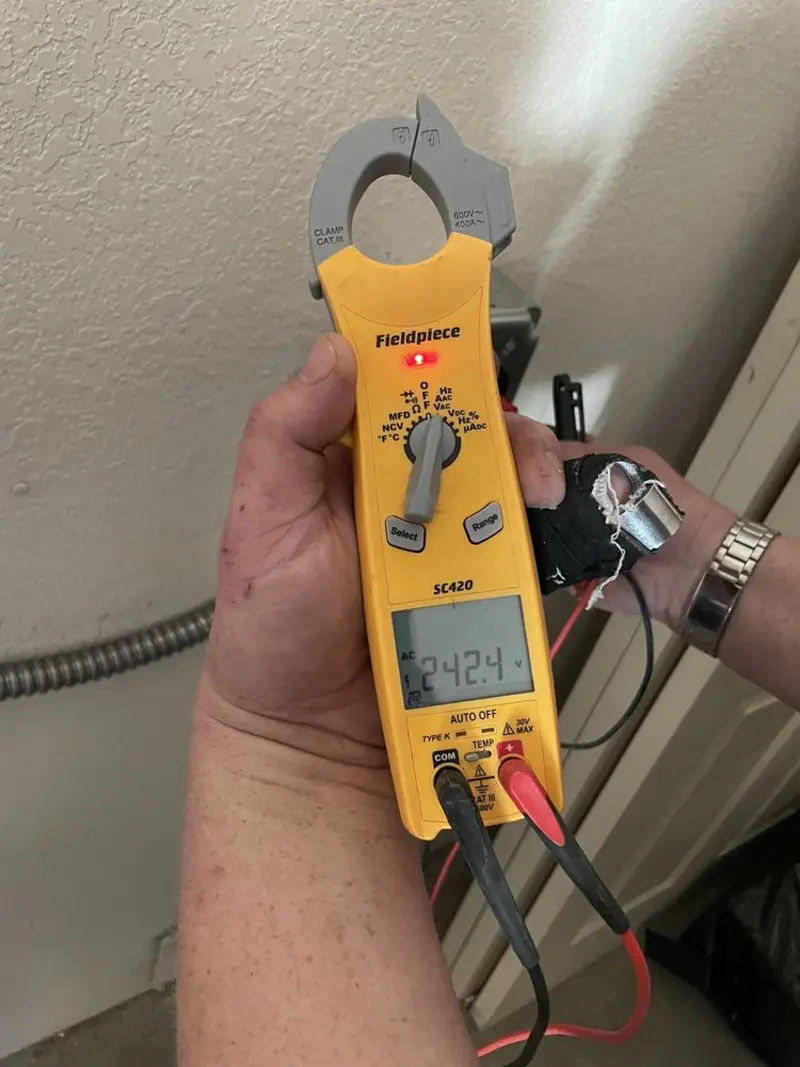 Voltage testing with clamp meter during Electrical Installation Services in Muleshoe